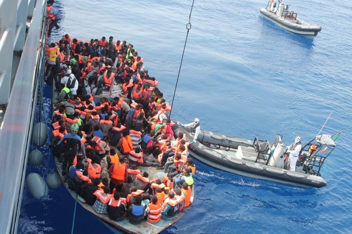 Irish Naval Service rescuing migrants from a boat as part of Operation Triton, June 2015.