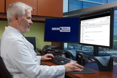 James Thomas, MD, PhD, oncologist and medical director, Froedtert & MCW Cancer Clinical Trials Office and Translational Research Unit analyzes patient data using a version of Watson for Clinical Trial Matching built specifically for the Froedtert & MCW Cancer Network, which includes four locations in southeastern Wisconsin. (Image: Froedtert & MCW Cancer Network)