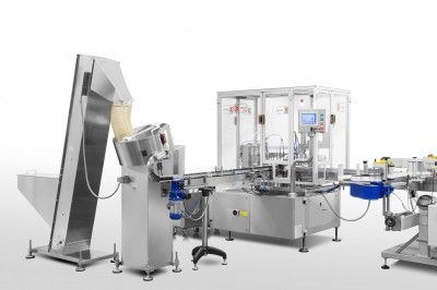 COMAS FC7 filling and capping machine with elevator and centrifugal hopper. Image: COMAS