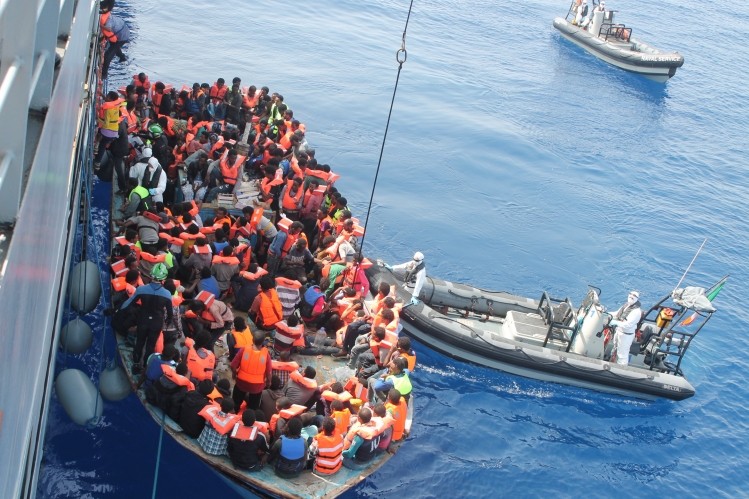 Irish Naval Service rescuing migrants from a boat as part of Operation Triton, June 2015.
